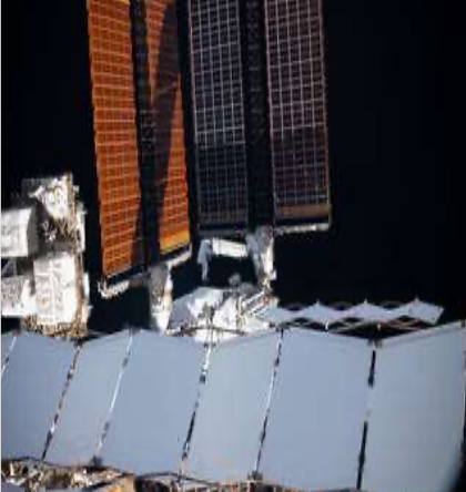 Astronauts fixing solar array during space walk Image credits: NASA