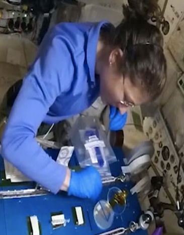 Astronaut Christina Koch conducting a CRISPR gene- editing experiment on Yeast Cells Source: NASA