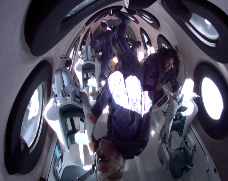 Richard Branson and Sirisha Bandla experiencing weightlessness aboard VSS Unity Source: Twitter@virgingalactic