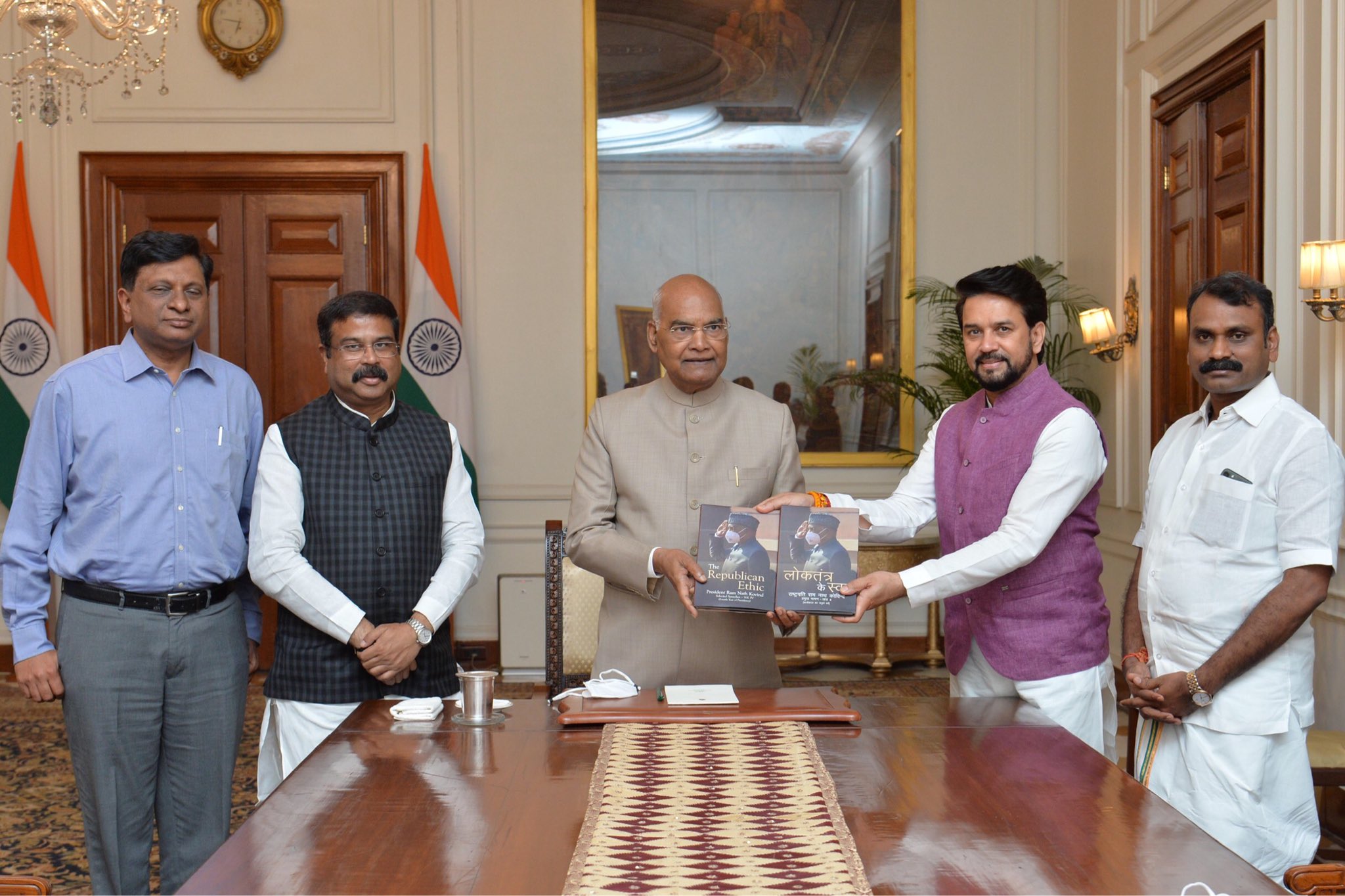 President Ram Nath Kovind receiving copies of the book of his speeches.